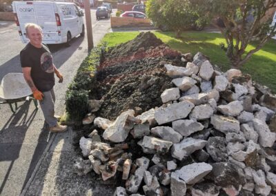 A pile of rubbish that's been dug out using a mini digger and driver hire service, ready to be collected by a grab lorry