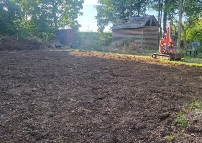 A garden that has been dug over and filtered using the mini digger and driver hire service