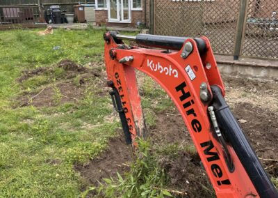 A garden during bamboo removal using a mini digger and driver hire service by The Mini Digger Guy