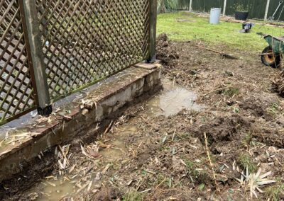 A garden during bamboo removal using a mini digger and driver hire service by The Mini Digger Guy