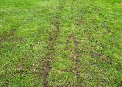 A photo showing a now-filled-in trench after installing pipework. The trench was dug using a mini digger. Mini digger and driver hire in Hertfordshire, Bedfordshire, and Cambridgeshire - The Mini Digger Guy